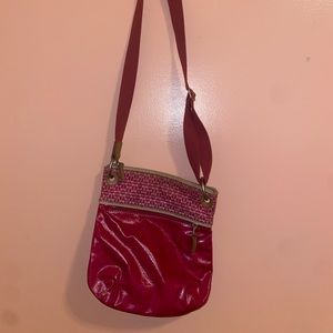 A hot pink fossil cross body bag